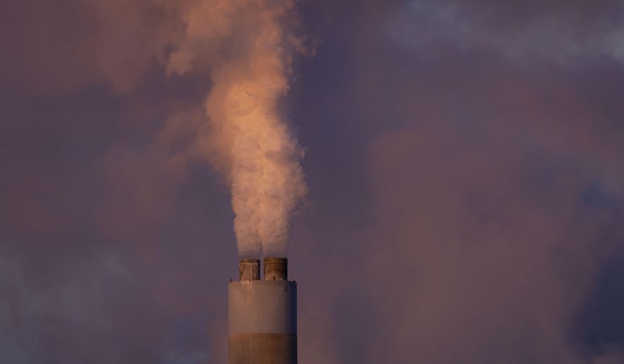FILE - Carbon dioxide and other pollutant billows from a stack at PacifiCorp’s coal-fired Naughton Power Plant, near where Bill Gates company, TerraPower plans to build an advanced, nontraditional nuclear reactor, Jan. 13, 2022, in Kemmerer, Wyo. (AP Photo/Natalie Behring, File)