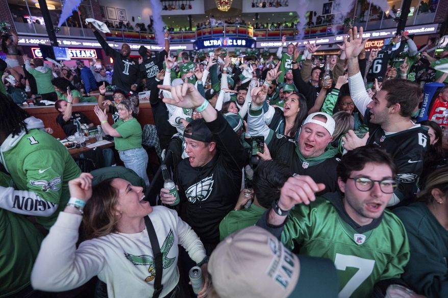 Philadelphia Eagles fans react to the Eagles first touchdown at the watch party for NFL football's Super Bowl 59 game against the Kansas City Chiefs, Sunday, Feb. 9, 2025, at Xfinity Live! Philadelphia. in Philadelphia. (AP Photo/Chris Szagola)