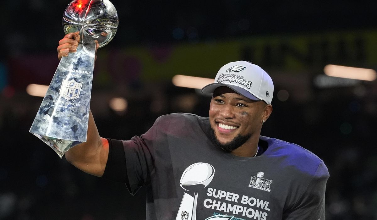 NextImg:Eagles running back Saquon Barkley sets the NFL’s season rushing record, including the playoffs