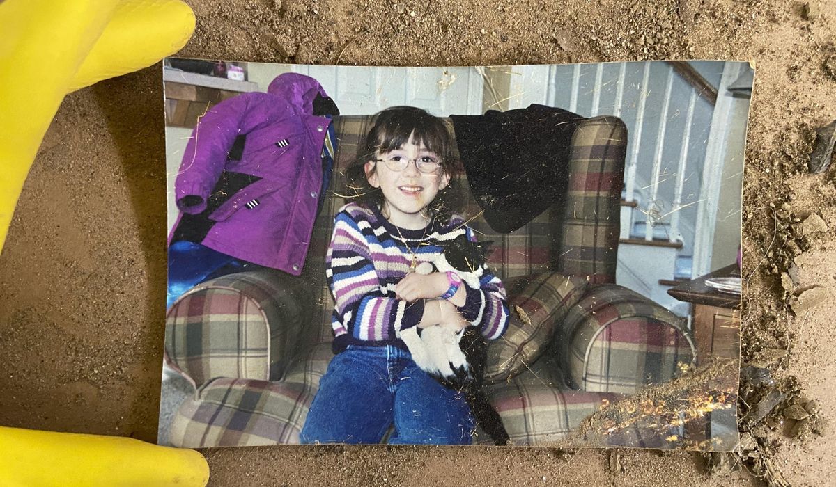 NextImg:How photos lost in American disasters find their way home, with a little help from people who care