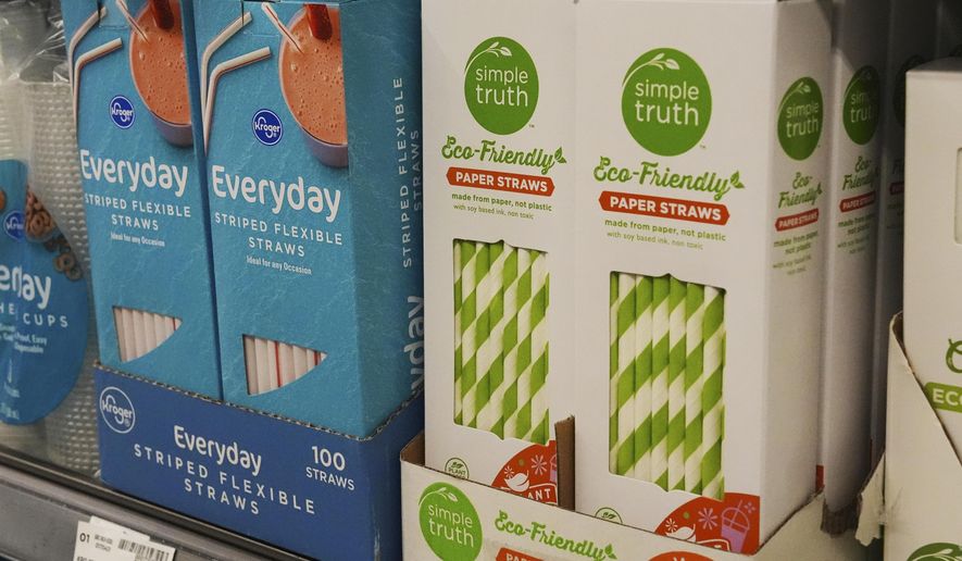 Plastic straws, left, sit next to paper straws on display for sale in Cincinnati on Tuesday, Feb. 11, 2025. (AP Photo/Joshua A. Bickel)