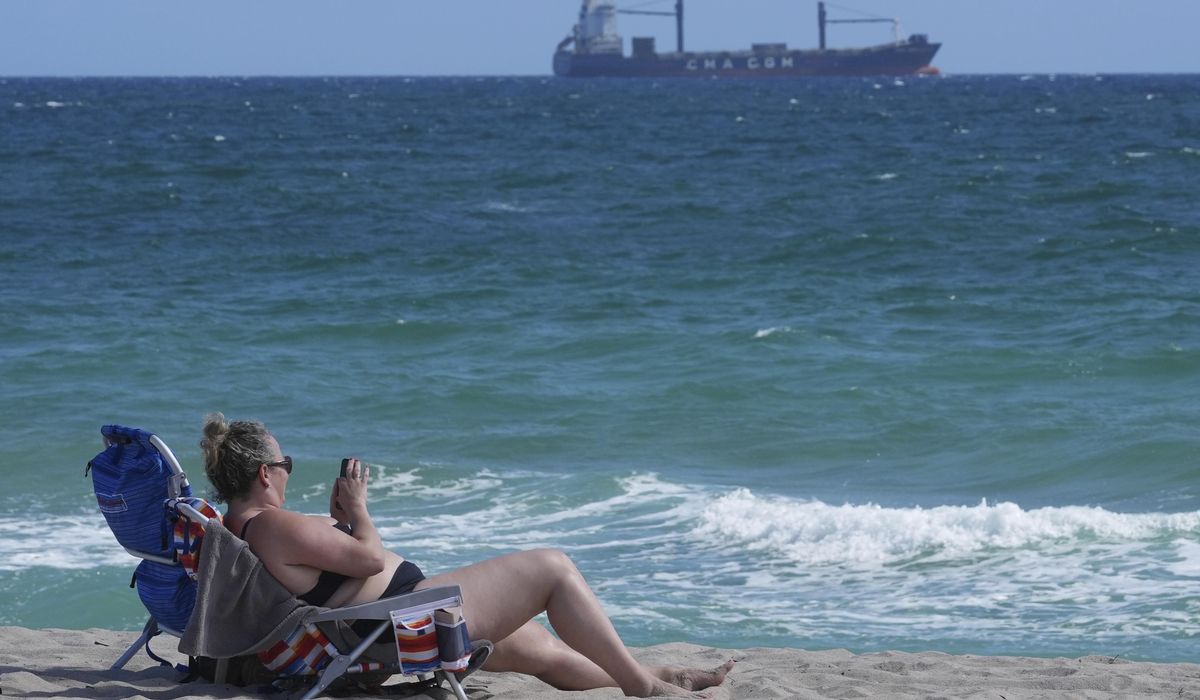 NextImg:Tar balls wash ashore on Florida beaches, but the source of the sticky black goo is a mystery