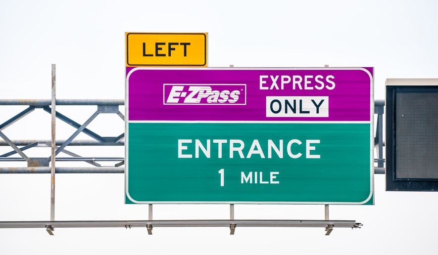 EZPass EZ Pass exit lane for toll with sign text for entrance and left turn in Virginia. File photo credit: Kristi Blokhin via Shutterstock.
