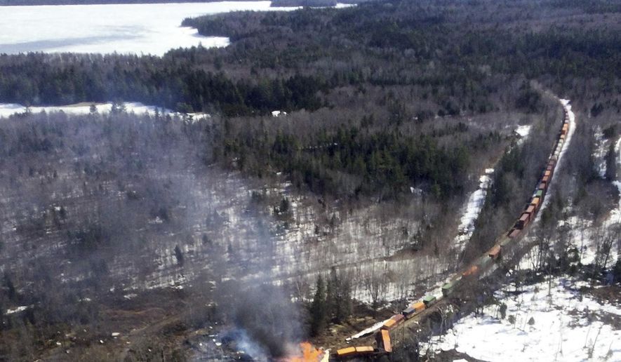 This photo provided by the Maine Forest Service shows several locomotives and rail cars burning after a freight train derailed, Saturday, April 15, 2023, in Sandwich Academy Grant Township, near Rockwood, Maine. (Maine Forest Service via AP, File)