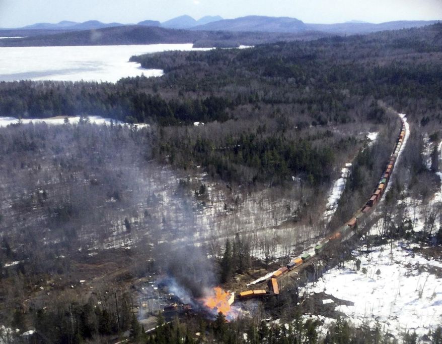 This photo provided by the Maine Forest Service shows several locomotives and rail cars burning after a freight train derailed, Saturday, April 15, 2023, in Sandwich Academy Grant Township, near Rockwood, Maine. (Maine Forest Service via AP, File)
