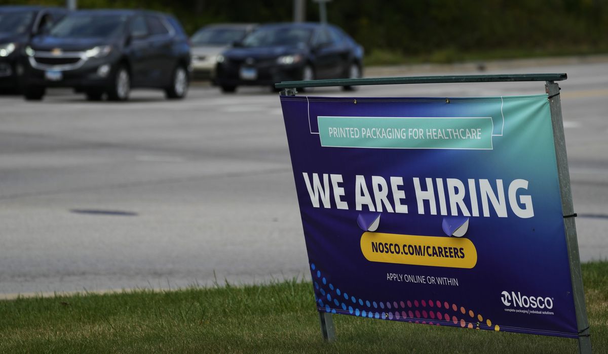 NextImg:The number of Americans seeking jobless benefits falls as employers continue to hold on to workers