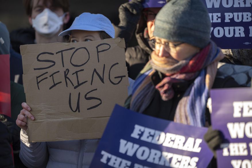 Demonstrators rally in support of federal workers outside of the Department of Health and Human Services, Friday, Feb. 14, 2025, in Washington. (AP Photo/Mark Schiefelbein) **FILE**