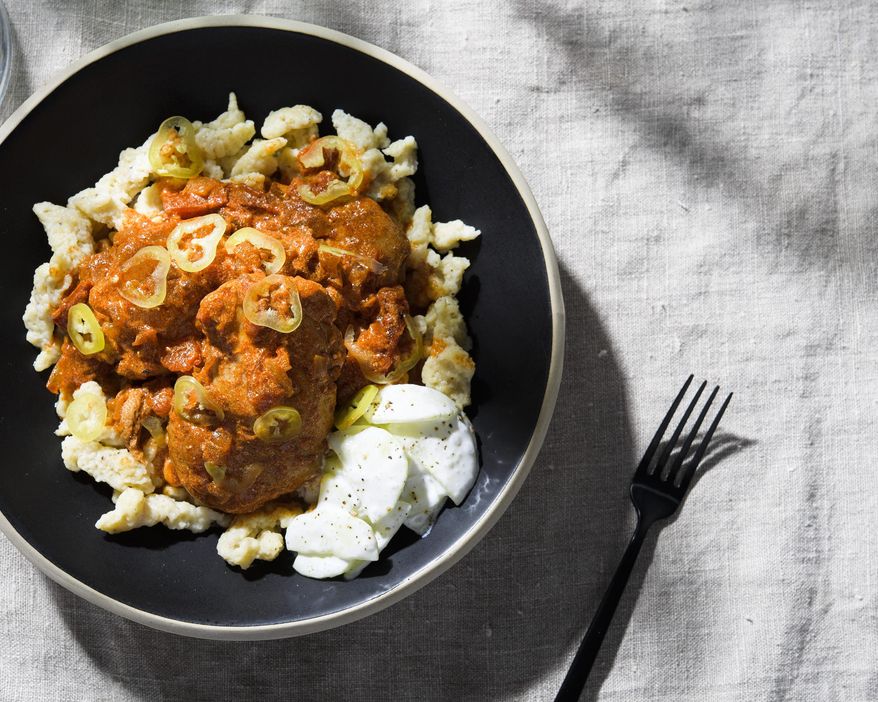 This image released by Milk Street shows a recipe for Hungarian chicken paprikash. (Milk Street via AP)