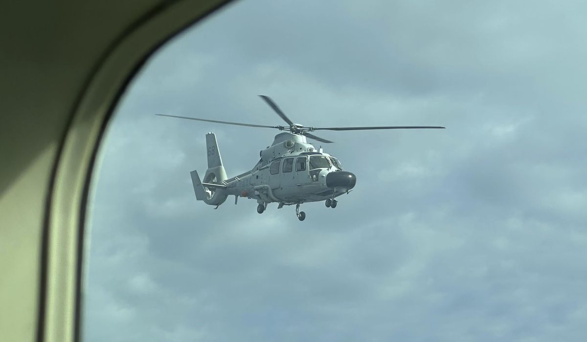 NextImg:Chinese navy helicopter flies within 10 feet of Philippine patrol plane over disputed shoal