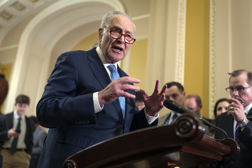 Senate Minority Leader Chuck Schumer, D-N.Y., speaks to reporters after a closed-door strategy meeting at the Capitol in Washington, Wednesday, Feb. 19, 2025. (AP Photo/J. Scott Applewhite) ** FILE **