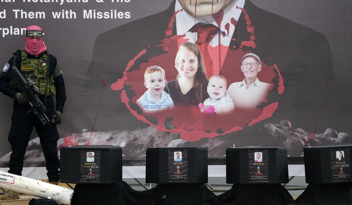 NextImg:Israel grieves as Hamas turns over the remains said to be of a mother and her 2 young children