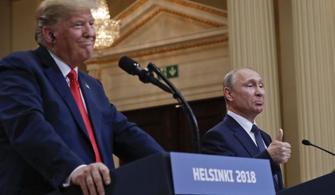 FILE - Russian President Vladimir Putin, right, and U.S. President Donald Trump give a joint news conference at the Presidential Palace in Helsinki, Finland, July 16, 2018. (AP Photo/Pablo Martinez Monsivais, File)