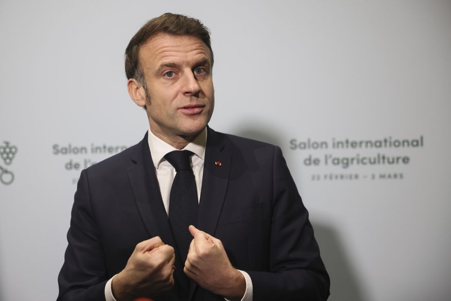 France's President Emmanuel Macron, center, adresses to media during the inauguration of the International Agriculture Fair, in Paris, France, Saturday, Feb. 22, 2025. (AP Photo/Thomas Padilla, Pool)