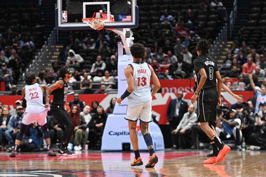 Washington Wizards guard Jordan Poole (13) watching his three point shot go in the net during the fourth quarter of an NBA game against the Brooklyn Nets at Capital One Arena in Washington D.C., February 24, 2025. (Photo for the Washington Times)