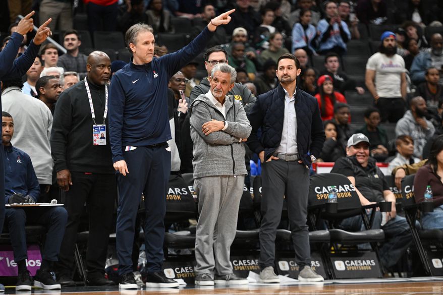 Washington Wizards owner Ted Leonsis (middle), and son Zach watch head coach Brian Keefe during the fourth quarter of an NBA game against the Brooklyn Nets at Capital One Arena in Washington D.C., February 24, 2025. (Photo for the Washington Times)