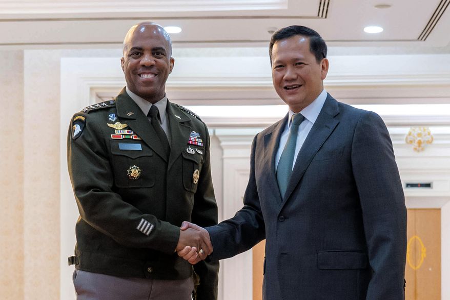 In this photo released by Agence Kampuchea Press (AKP), Cambodian Prime Minister Hun Manet, right, shakes hands with Gen. Ronald P. Clark, left, the commanding general of U.S. Army Pacific, left, during a welcome meeting at the Peace Palace in Phnom Penh, Cambodia, Monday, Feb. 24, 2025. (AKP via AP)