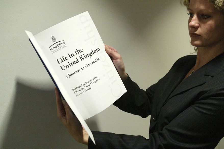 A woman holds a copy of the 'Life in the United Kingdom' book aimed at assisting applicants to pass the 'Life in the UK test' at the British Museum in central London, Oct, 31, 2005. (AP Photo/Sergio Dionisio, File)