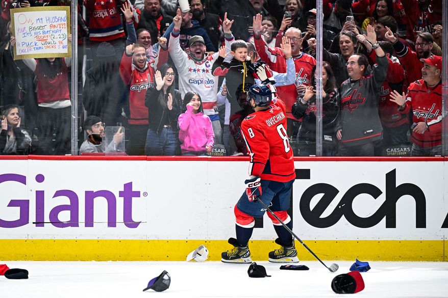 Washington Capitals left wing Alex Ovechkin (8) celebrates with his son, Sergei, after completing the 32nd hat trick of his distinguished career in a 7-3 rout of the Edmonton Oilers at Capital One Arena, Washington, D.C., February 23, 2025. (Photo by Brian Murphy for the Washington Times)