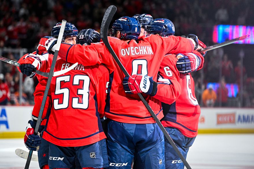 Washington Capitals left wing Alex Ovechkin (8) celebrates with teammates after defenseman Jakob Chychrun (6) scored a power play goal against the Edmonton Oilers at Capital One Arena, Washington, D.C., February 23, 2025. (Photo by Brian Murphy for the Washington Times)