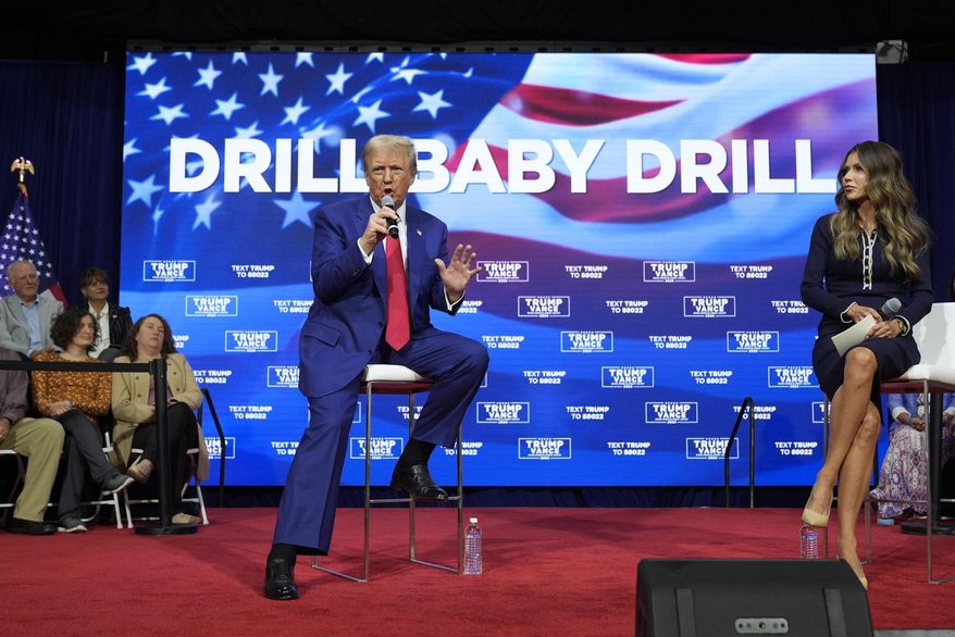 Then-Republican presidential nominee former President Donald Trump speaks at a campaign town hall at the Greater Philadelphia Expo Center & Fairgrounds, Oct. 14, 2024, in Oaks, Pa., as moderator South Dakota Gov. Kristi Noem listens. (AP Photo/Alex Brandon, File)