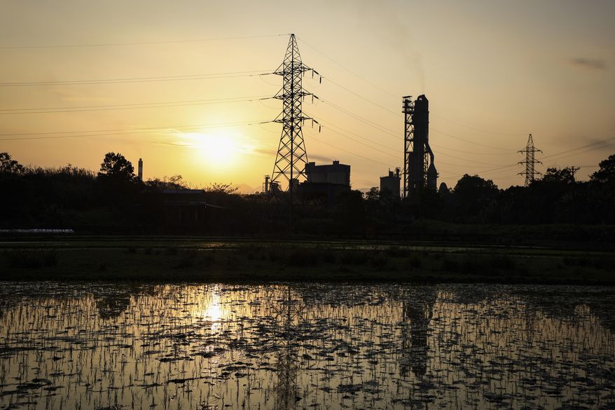 Khanh Hoa Thermal Power Station, a coal-fired power plant, operates Tuesday, Jan. 28, 2025, in Thai Nguyen, Vietnam. (AP Photo/Yannick Peterhans)