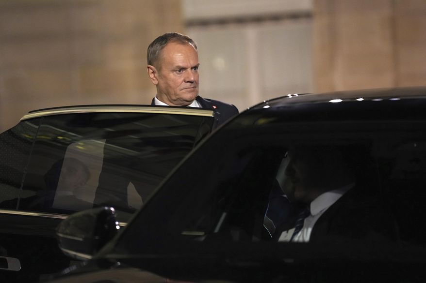 Poland's Prime Minister Donald Tusk gets into his car as he leaves the Elysee Palace, after an informal meeting of leaders from key European Union nations and the United Kingdom, in Paris, Monday, Feb. 17, 2025. (AP Photo/Aurelien Morissard)