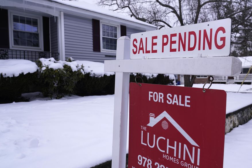 "Sale Pending" is posted on an existing home for sale real estate sign, Feb. 27, 2023, in Salem, N.H. (AP Photo/Charles Krupa, file)
