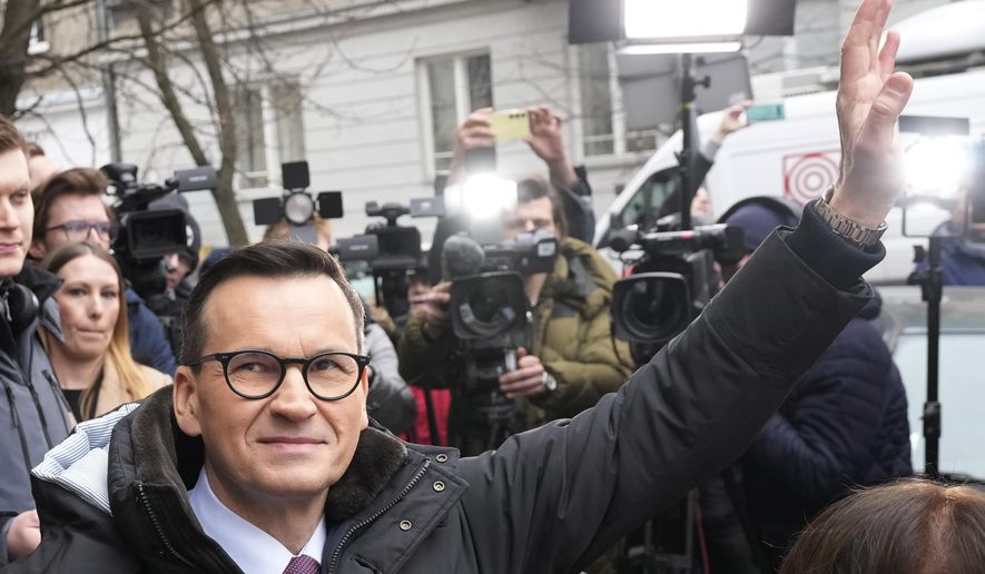 Former Polish Prime Minister Mateusz Morawiecki speaks to supporters before being interrogated by prosecutors in Warsaw, Poland, on Thursday, Feb. 27, 2025. (AP Photo/Czarek Sokolowski)