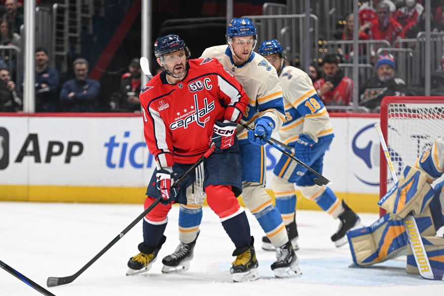 Washington Capitals left wing Alex Ovechkin (8) fighting for position with St. Louis Blues defenseman Philip Broberg (6) in front of the net during the second period of an NHL game at Capital One Arena in Washington D.C., February 27, 2025. (Photo for the Washington Times)