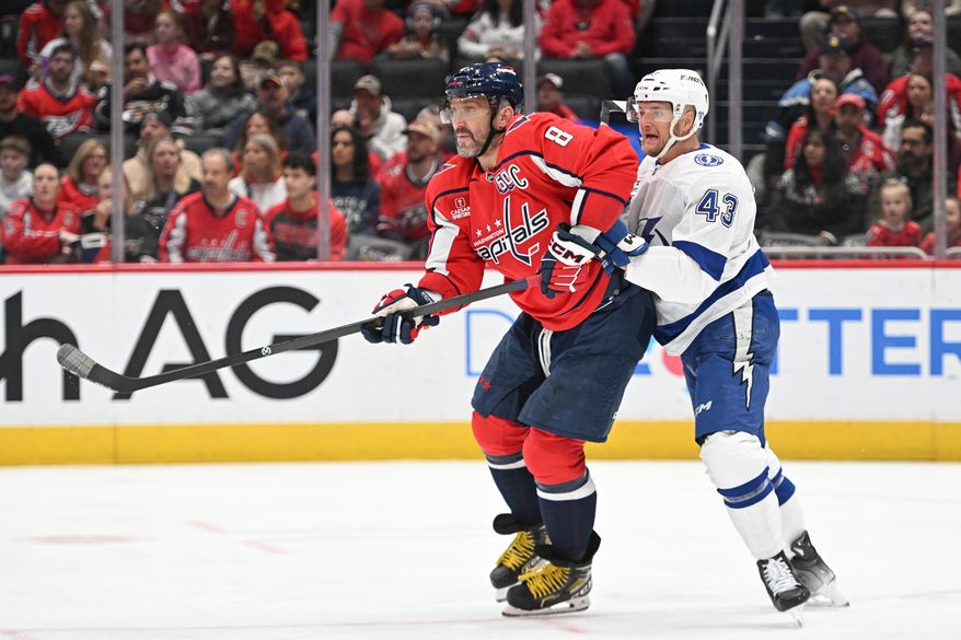 Washington Capitals left wing Alex Ovechkin (8) fighting for postion in front of the net with Tampa Bay Lightning defenseman Darren Raddysh (43) during the first period of an NHL game at Capital One Arena in Washington D.C., March 1, 2025. (Photo for the Washington Times)