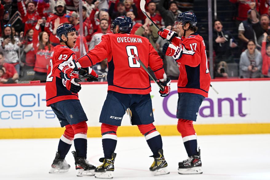 Washington Capitals left wing Alex Ovechkin (8) celebrating his goal with teammates Martin Fehervary (42) and Dylan Strome (17) during the third period of an NHL game against the Tampa Bay Lightning at Capital One Arena in Washington D.C., March 1, 2025. (Photo for the Washington Times)