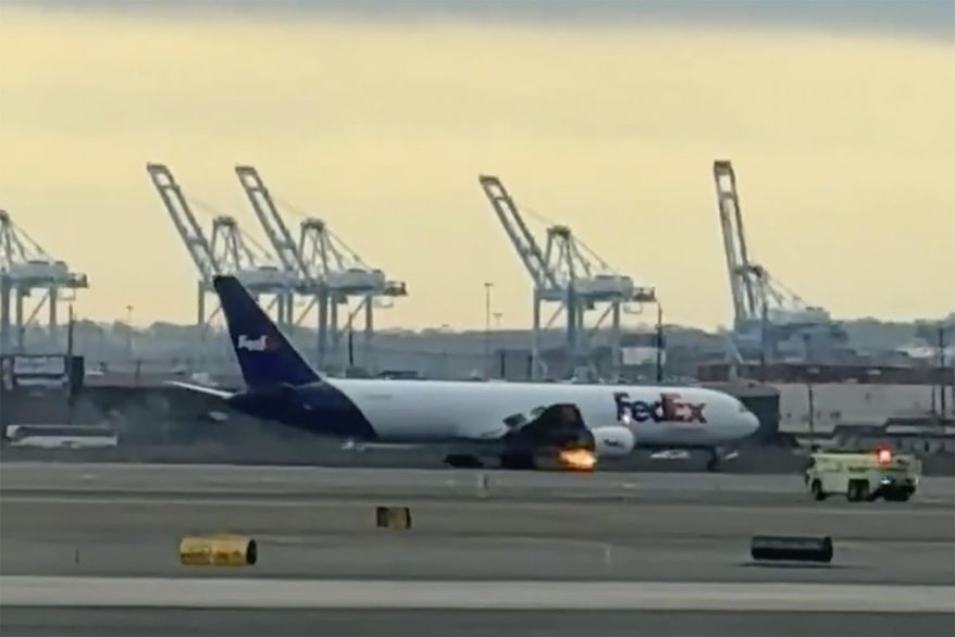 In this photo provided by Kenneth Hoffman, a FedEx cargo plane makes an emergency landing at Newark Liberty International Airport on Saturday, March 1, 2025 in Newark, N.J. (Kenneth Hoffman via AP)