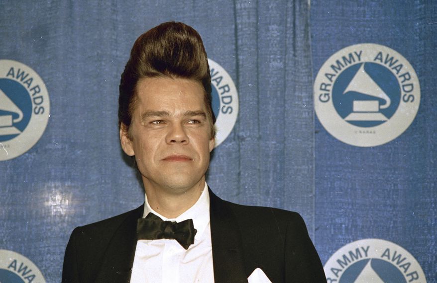 Buster Poindexter is seen at the Grammy Awards in New York's Radio City Music Hall, March 2, 1988. David Johansen, the wiry, gravelly-voiced singer and last surviving member of the glam and protopunk band the New York Dolls who later performed as his campy, pompadoured alter ego, Buster Poindexter, has died. He was 75. (AP Photo, File)