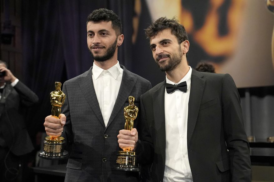 Basel Adra, left, and Yuval Abraham, winners of the award for best documentary feature film for "No Other Land," attend the Governors Ball after the Oscars on Sunday, March 2, 2025, in Los Angeles. (AP Photo/John Locher)
