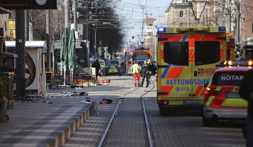 Emergency services and police stand at Paradeplatz in Mannheim, Germany, after a serious incident, Monday March 3, 2025. (Dieter Leder/dpa via AP)