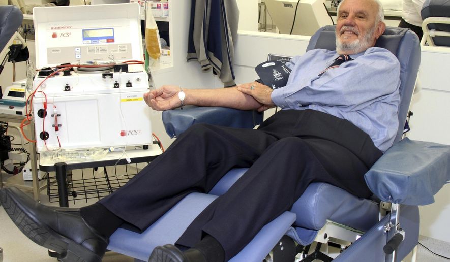 In this May, 2011, photo provided by Australian Red Cross Lifeblood donor James Harrison, credited with saving 2.4 million babies through his record-breaking blood plasma donations over decades, is giving blood at donation center in Sydney. (Australian Red Cross Lifeblood via AP)