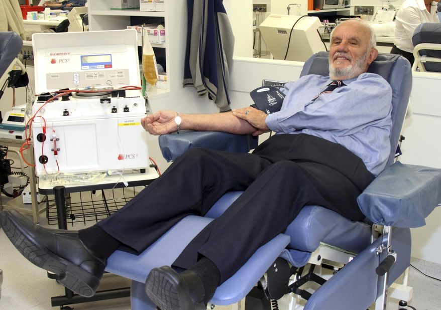 In this May, 2011, photo provided by Australian Red Cross Lifeblood donor James Harrison, credited with saving 2.4 million babies through his record-breaking blood plasma donations over decades, is giving blood at donation center in Sydney. (Australian Red Cross Lifeblood via AP)