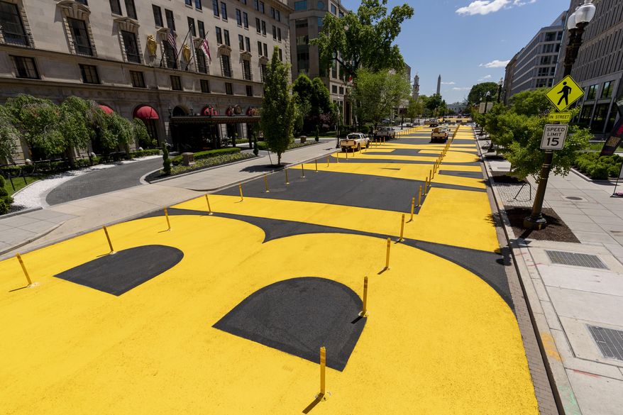 The letters at Black Lives Matter Plaza have been repainted after the street was repaved near the White House in Washington, May 13, 2021. (AP Photo/Andrew Harnik, File)