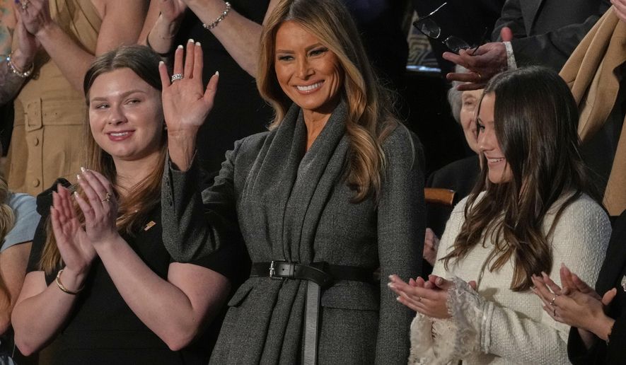 First lady Melania Trump waves before President Donald Trump addresses a joint session of Congress in the House chamber at the U.S. Capitol in Washington, Tuesday, March 4, 2025. (AP Photo/Julia Demaree Nikhinson)