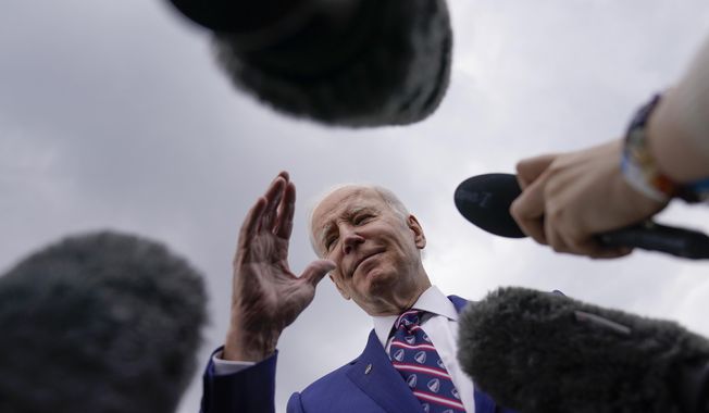 President Joe Biden talks with reporters be he boards Air Force One at Raleigh-Durham International Airport in Morrisville, N.C., Tuesday, March 28, 2023, en route to Washington. (AP Photo/Carolyn Kaster)