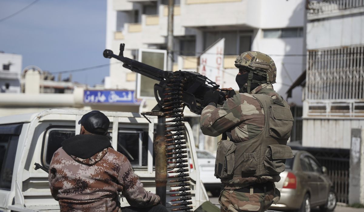 NextImg:Clashes in Syria between government forces and Assad loyalists kill nearly 150