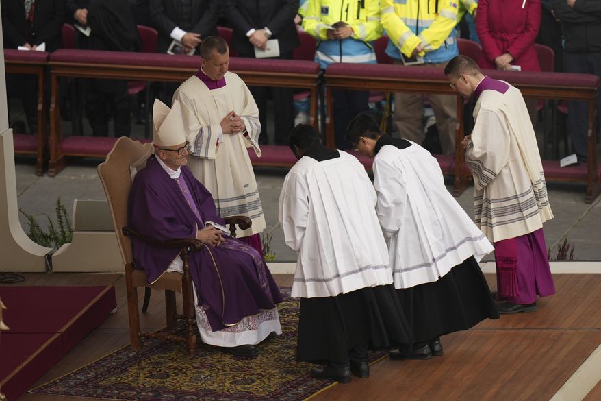 Cardinal Michael Czerny, left, delegate of Pope Francis who is being treated for pneumonia at Rome's Agostino Gemelli Polyclinic, celebrates a mass for the members of the world of volunteers in St. Peter's Square at The Vatican, Sunday, March 9, 2025. (AP Photo/Francisco Seco)