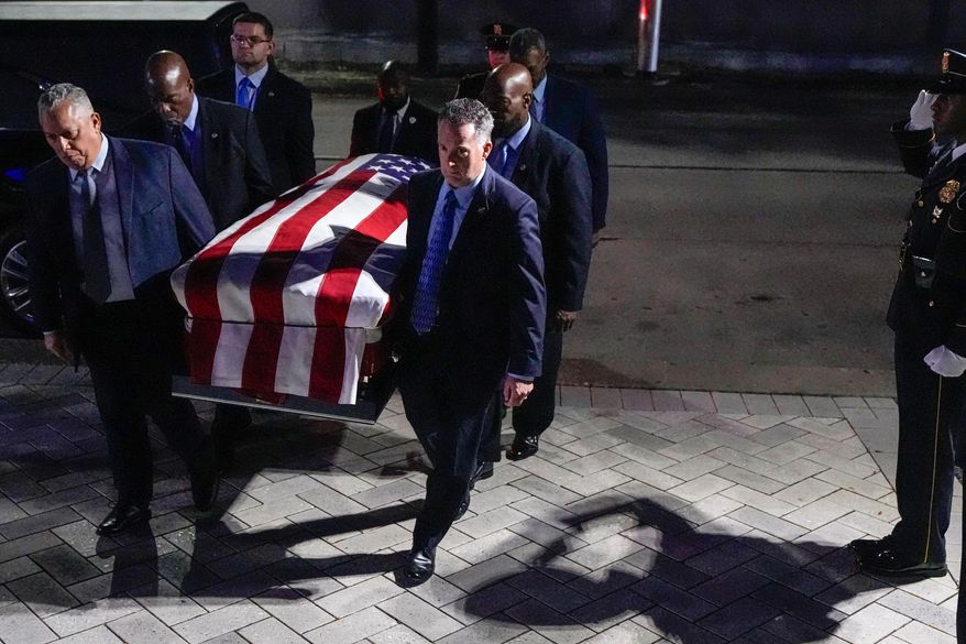 Former Houston Mayor and U.S. Rep. Sylvester Turner is carried into City Hall where he will lie in state in Houston, Tuesday, March 11, 2025. (Brett Coomer /Houston Chronicle via AP)