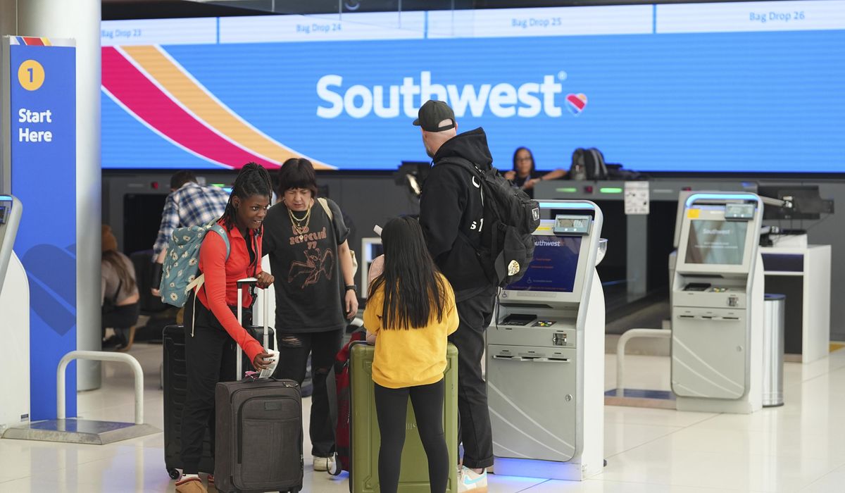 NextImg:Southwest to charge for checked bags, leaving some travelers asking ‘what’s the point?’