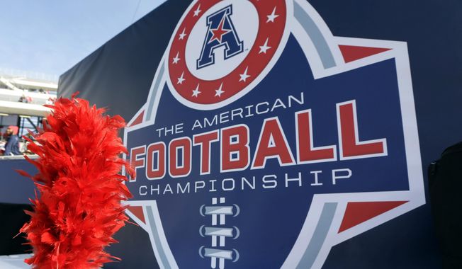 In this Dec. 5, 2015, file photo, the American Athletic Conference logo is displayed before during the championship NCAA college football game between Houston and Temple in Houston. (AP Photo/David J. Phillip, File)
