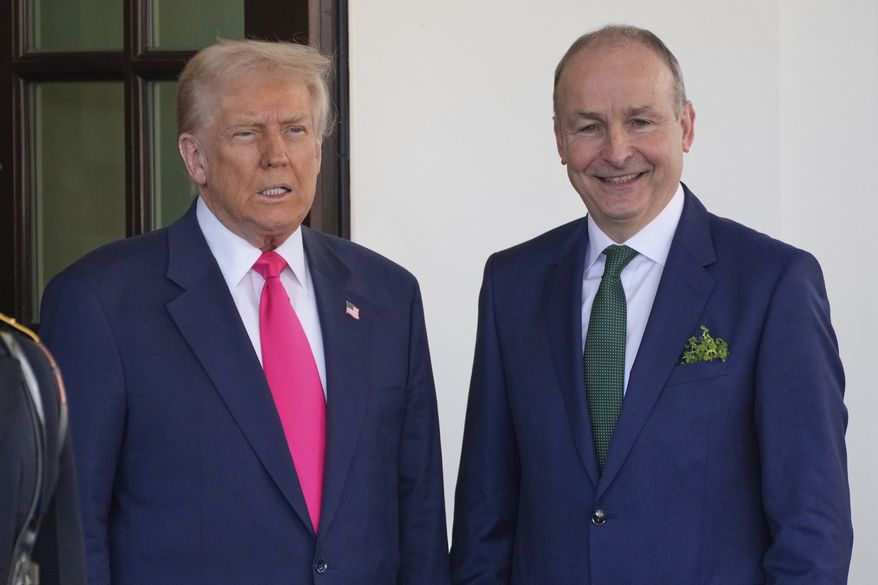 Ireland's Prime Minister Michael Martin is greeted by President Donald Trump as he arrives at the West Wing of the White House in Washington, Wednesday, March 12, 2025. (AP Photo/Ben Curtis)