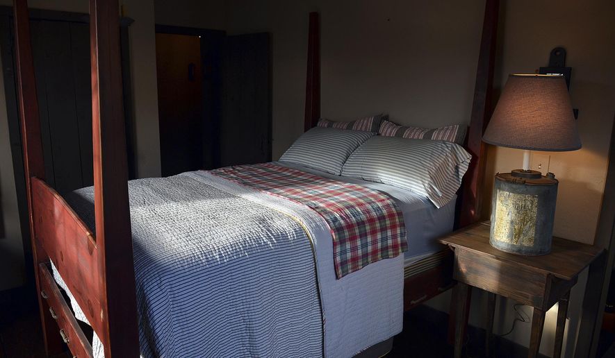 A shaft of light shines into a bedroom in Belle, W.Va., on Nov. 11, 2013. (Craig Cunningham/The Daily Mail via AP, File)