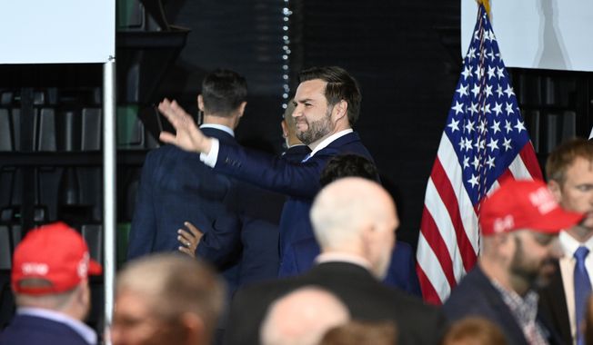 Vice President JD Vance waves following a rally where he spoke about "America's industrial resurgence," Friday, March 14, 2025, at Vantage Plastics in Bay City, Mich. (AP Photo/Jose Juarez)