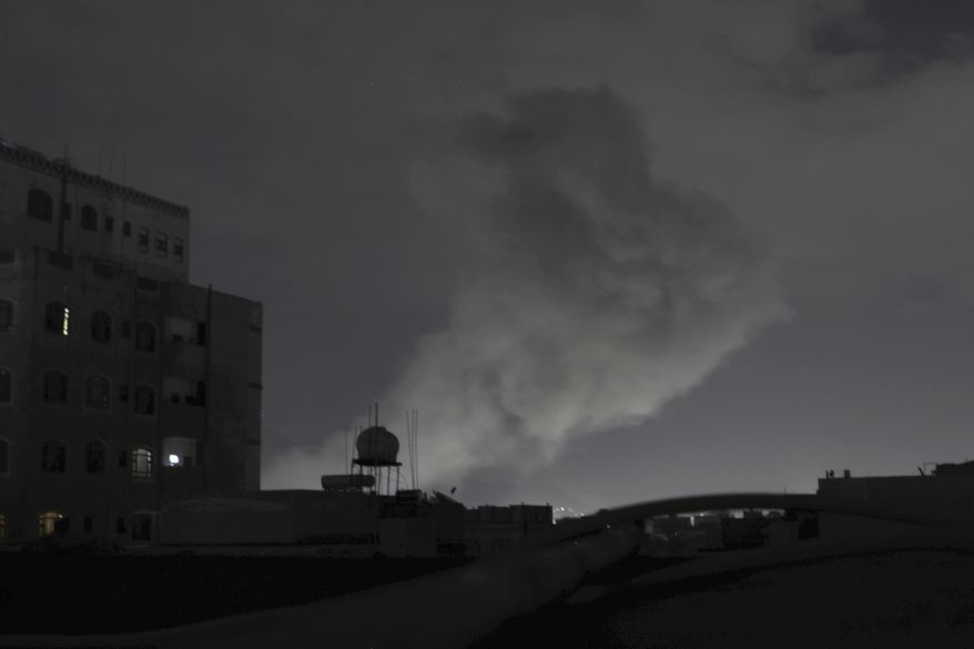 Smoke rises from a location reportedly struck by U.S. airstrikes in Sanaa, Yemen, Saturday, March 15, 2025. (AP Photo/Osamah Abdulrahman