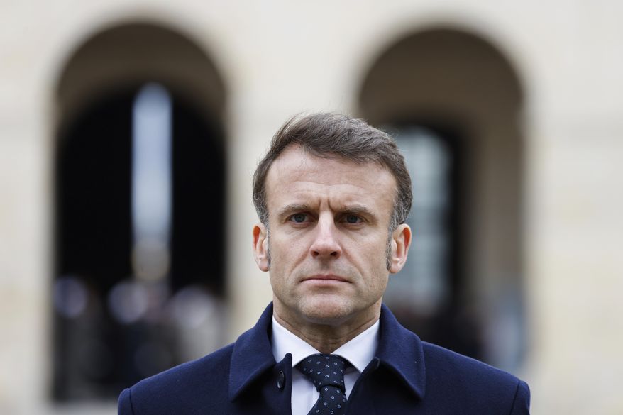 French President Emmanuel Macron attends an official welcome ceremony for Uzbekistan President Shavkat Mirziyoyev at the Invalides monument in Paris Wednesday, March 12, 2025. (Ludovic Marin, Pool via AP)